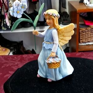 Angel statue wildflower Angel's Forget me not for remembrance